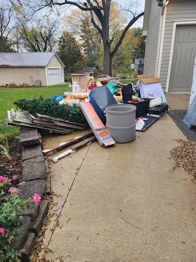Dumpster being loaded with debris for 3 Yard Dumpster Rental in Severna Park
